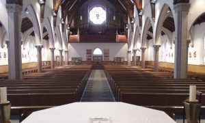 Inside a church from the sanctuary out toward the pews
