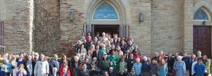 parish members stand outside the front doors of Immaculate Conception Church
