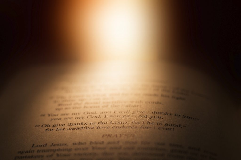 light shining on an open bible