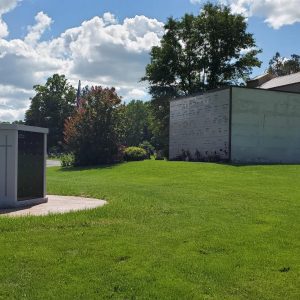 Columbarium with an etched cross in a cemetery