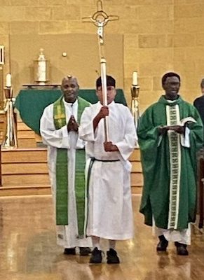 2 Priests and an Altar Server leaving Mass