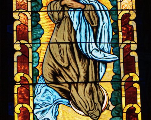 Stained glass window of Saint. Donated by Senior Sodality of Children of Mary.