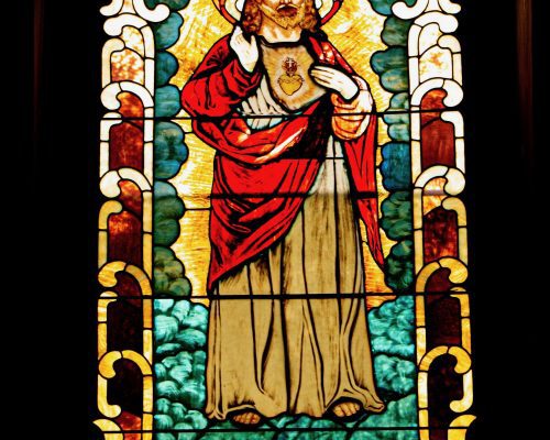 Stained glass window of Saint. Donated by Margaret Burns Sr. in memory of James Burns.