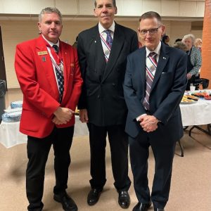 3 men from the Knights of Columbus at a reception