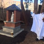 Father Chumo blesses the outdoor Mary Shrine
